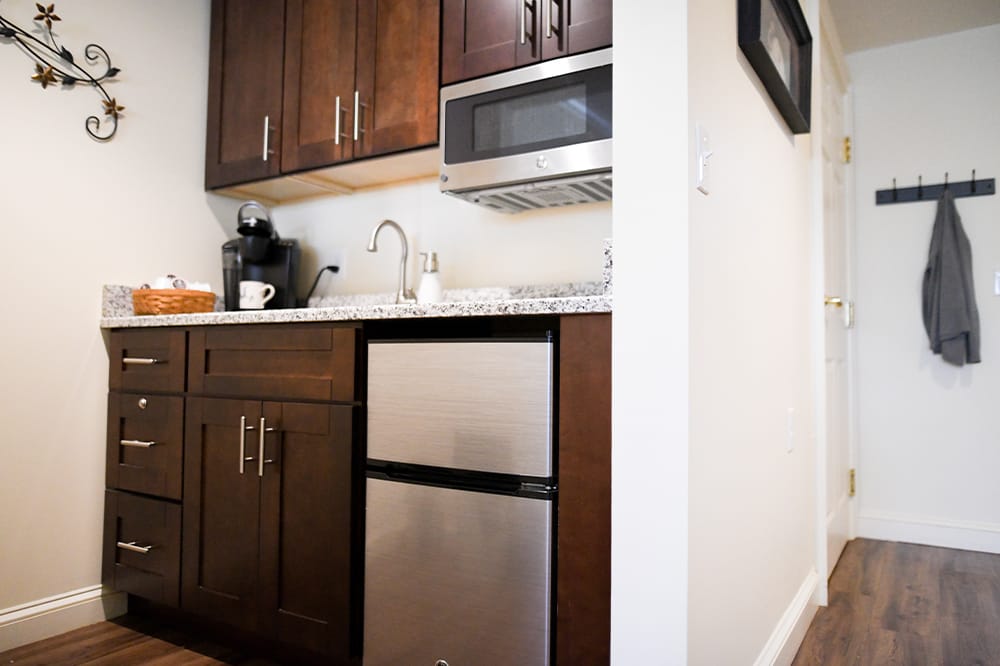Kitchen area with cabinets and appliances