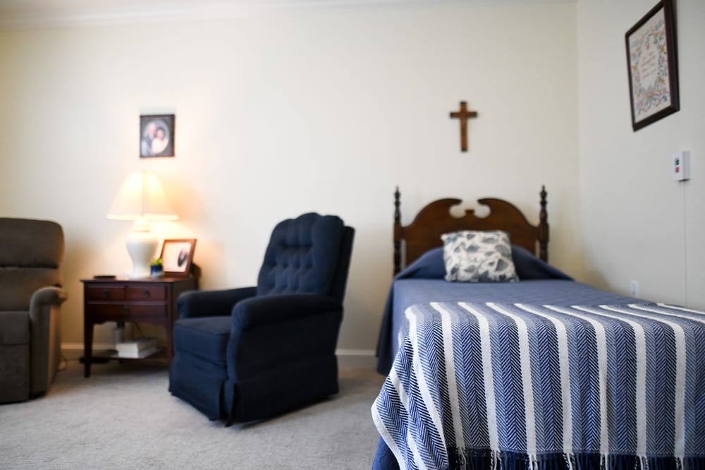 Cozy resident room with chair and lamp
