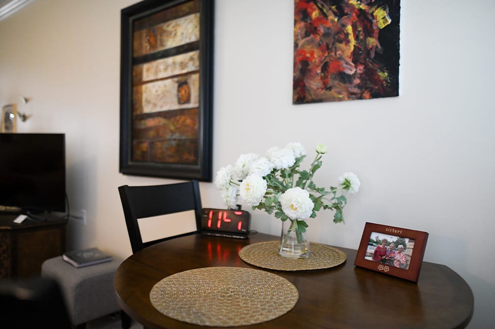 Warm and inviting interior dining area with flowers
