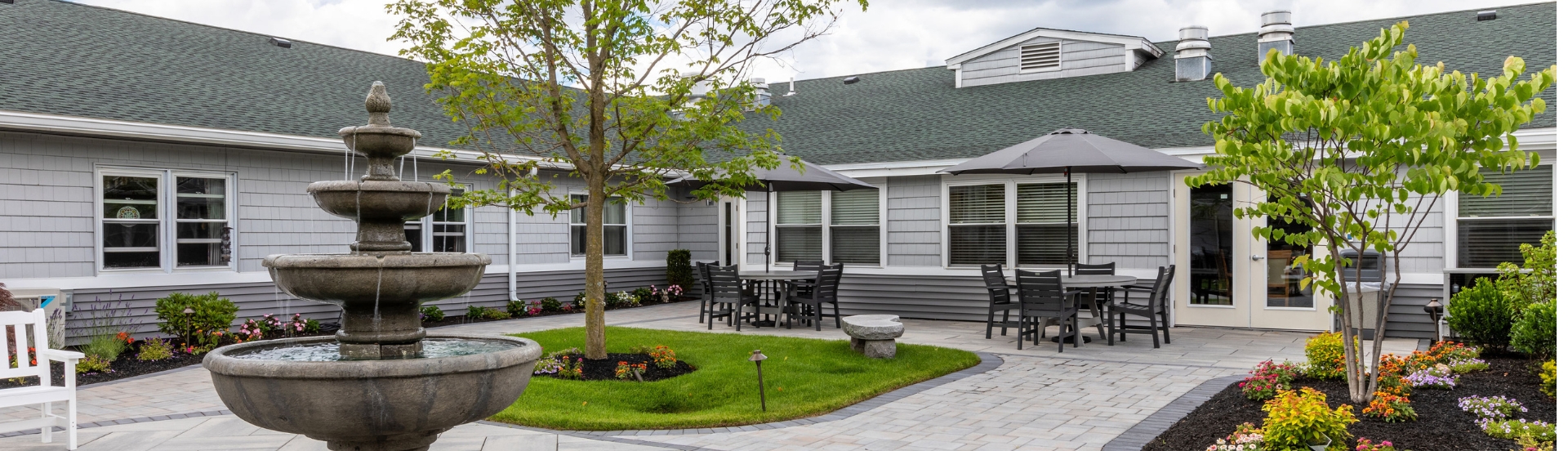 Outdoor courtyard with a fountain and seating