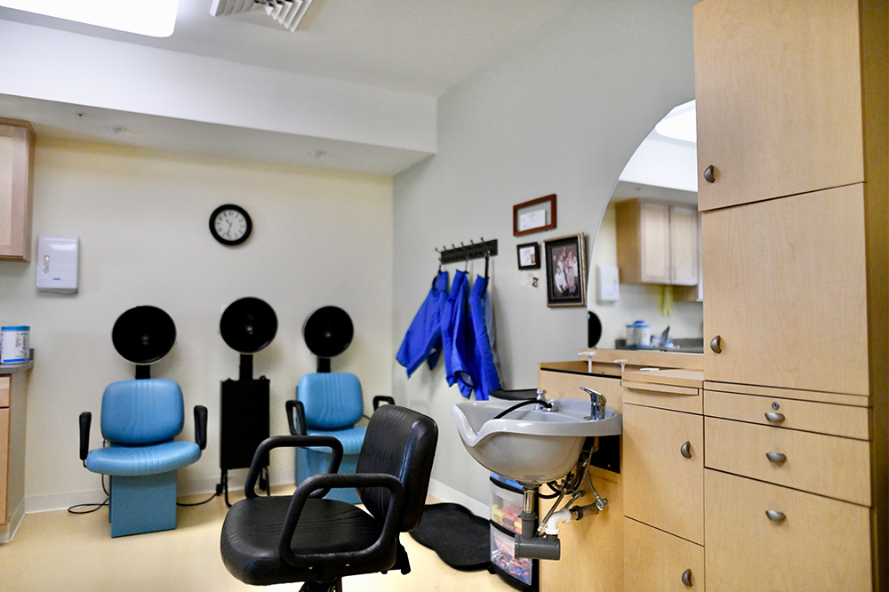 A hair salon with styling chairs and equipment