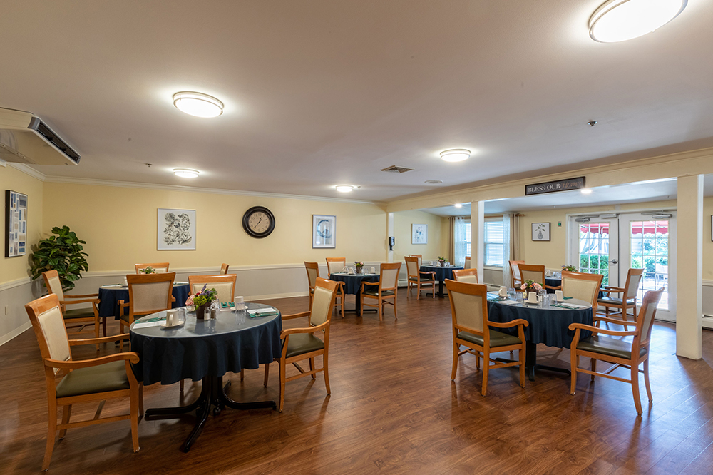 Dining room with tables set for residents