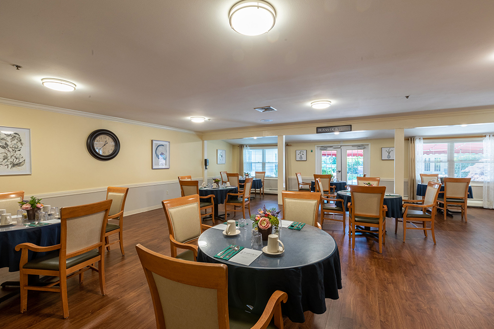 Dining room with tables set for residents