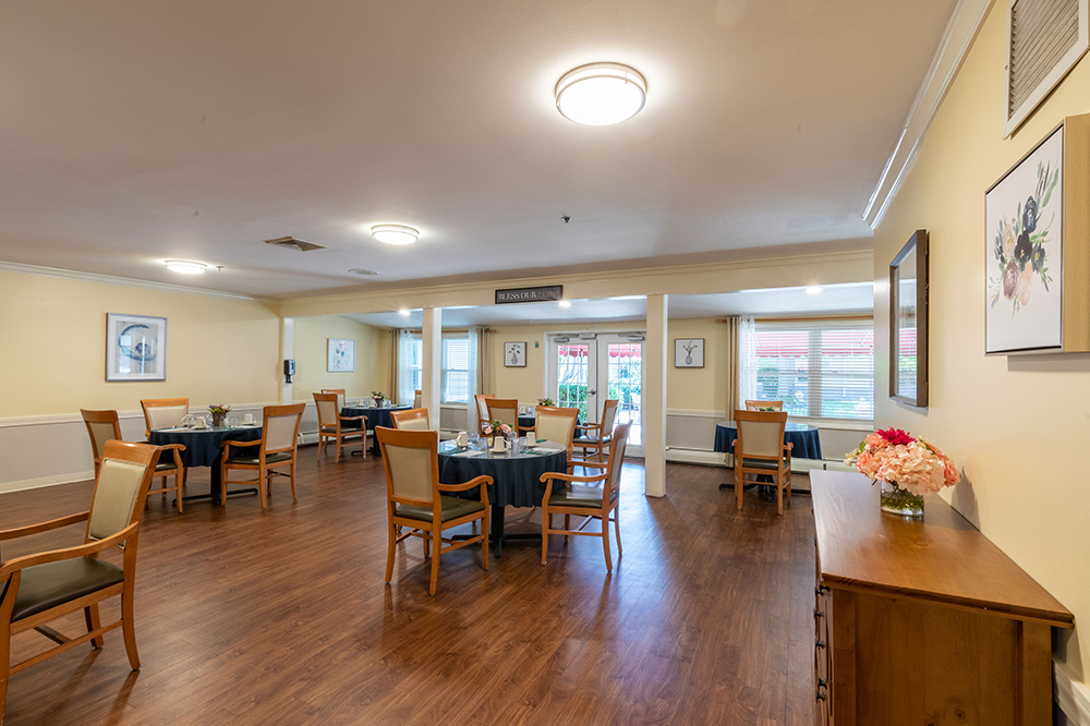 Dining room setup with tables and chairs