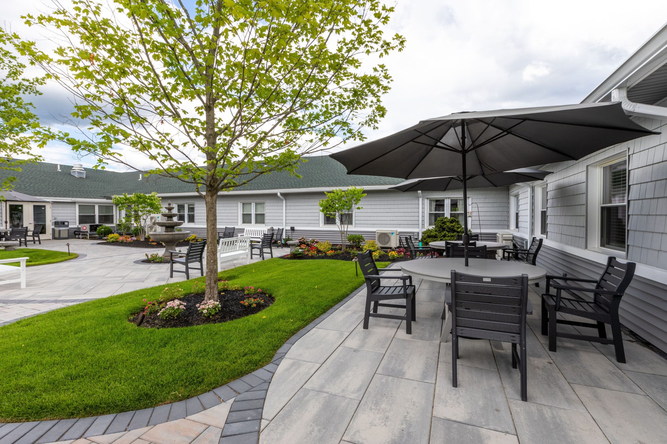 Outdoor courtyard with seating and landscaping