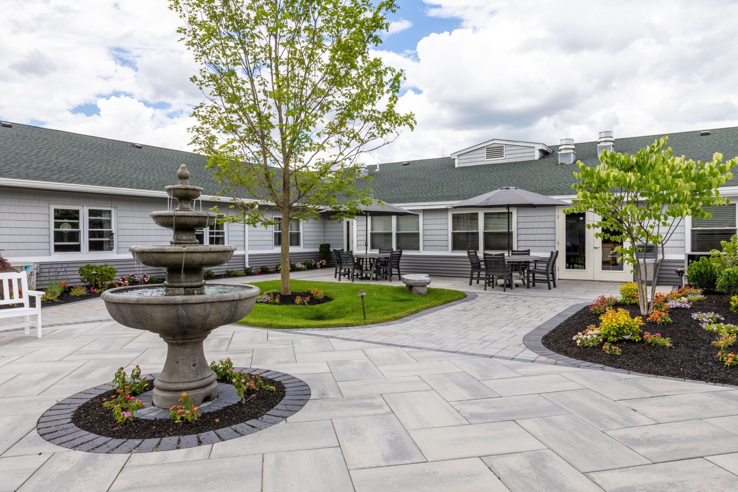 Outdoor courtyard with fountain and seating areas