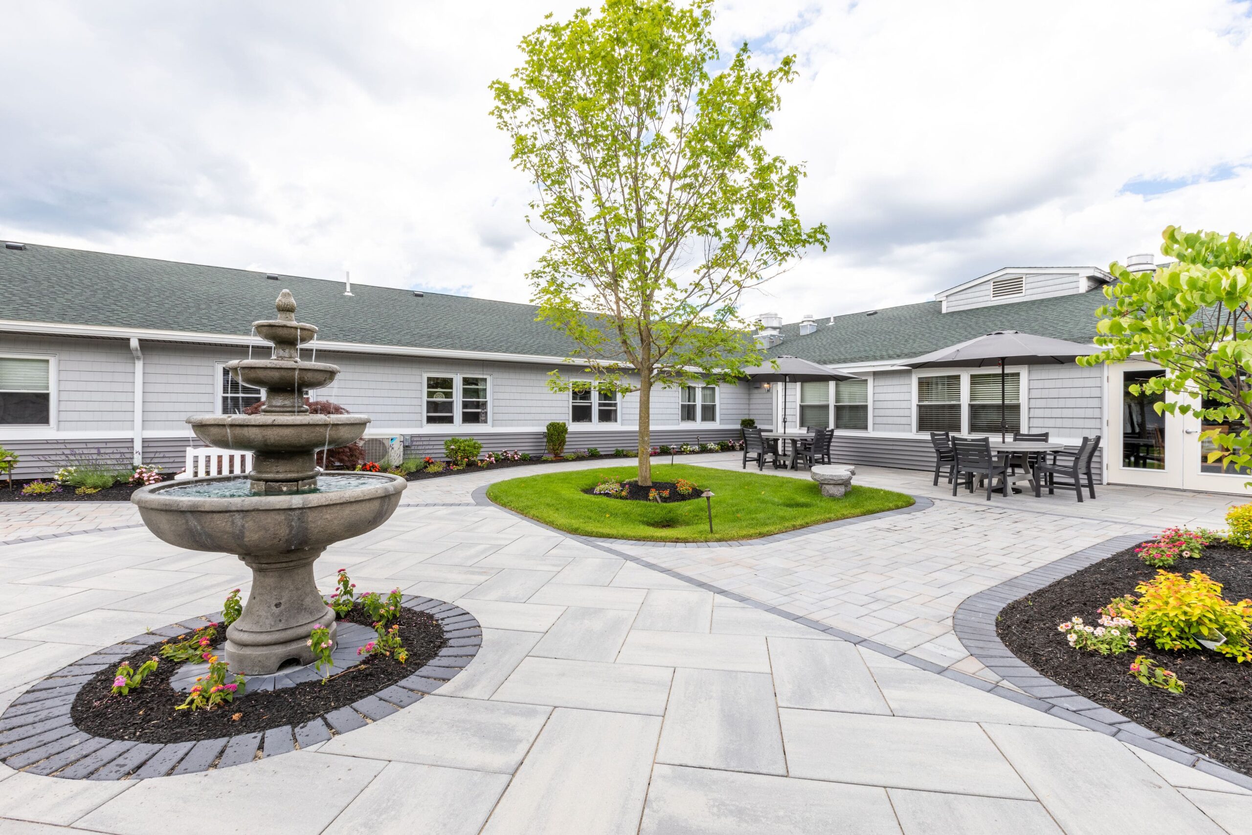 Outdoor courtyard with fountain and seating