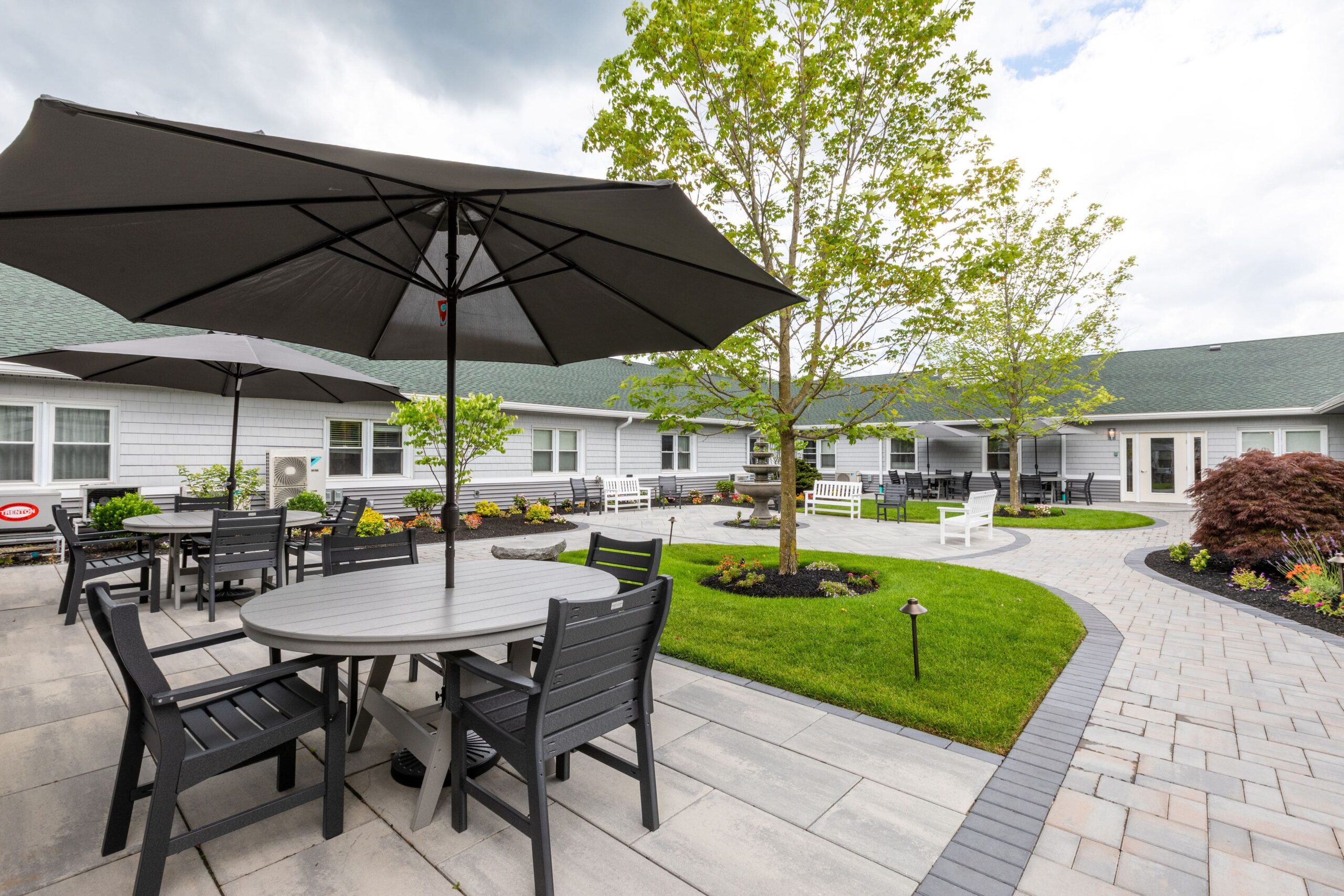 Outdoor courtyard with seating and greenery