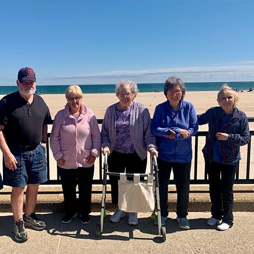 Five residents enjoying a day at the beach