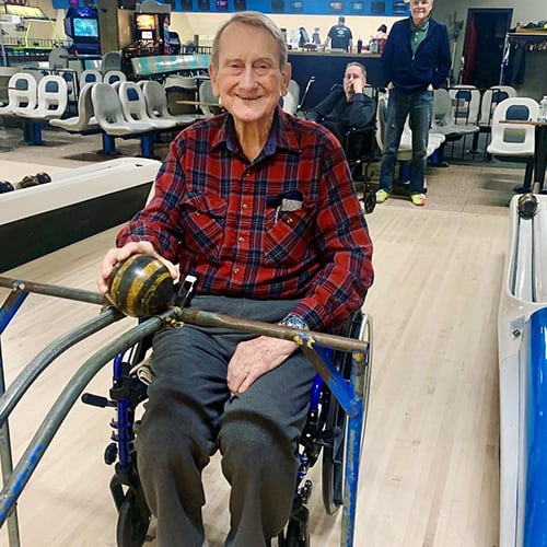 Residents enjoying a bowling activity in the facility
