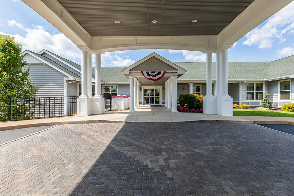 Entrance of The Inn at Fairview with landscaped area