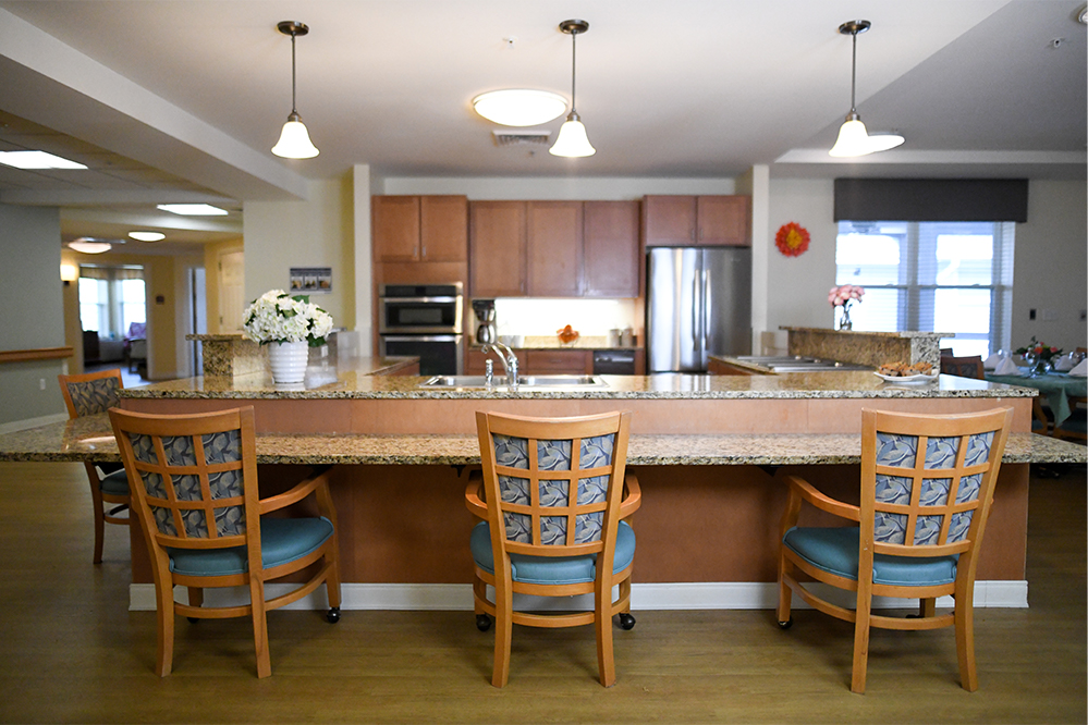 Interior view of a common area with kitchen bar stools