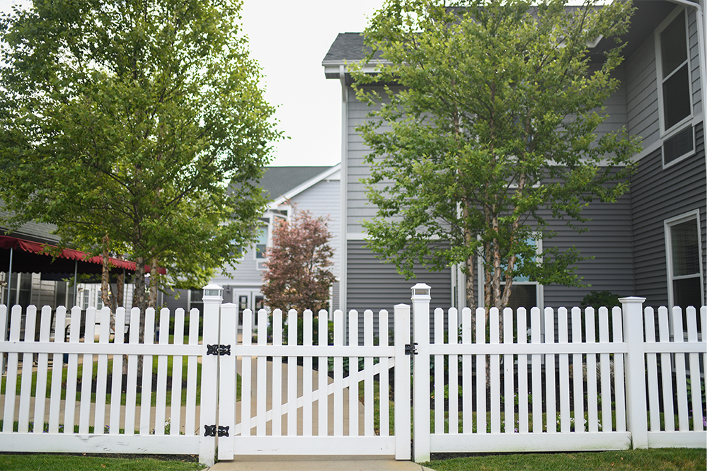 Exterior view of a fenced garden area