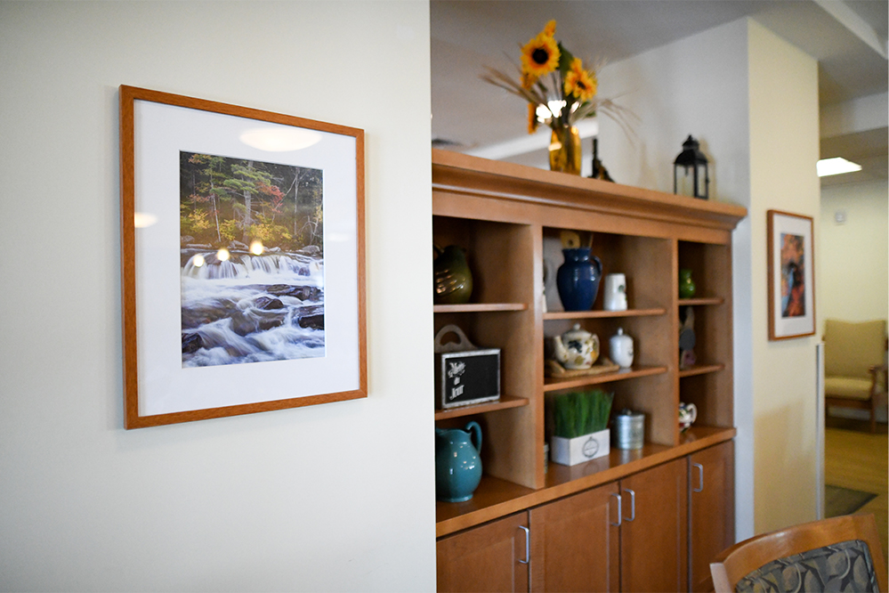 Interior common area with decor and a scenic photo