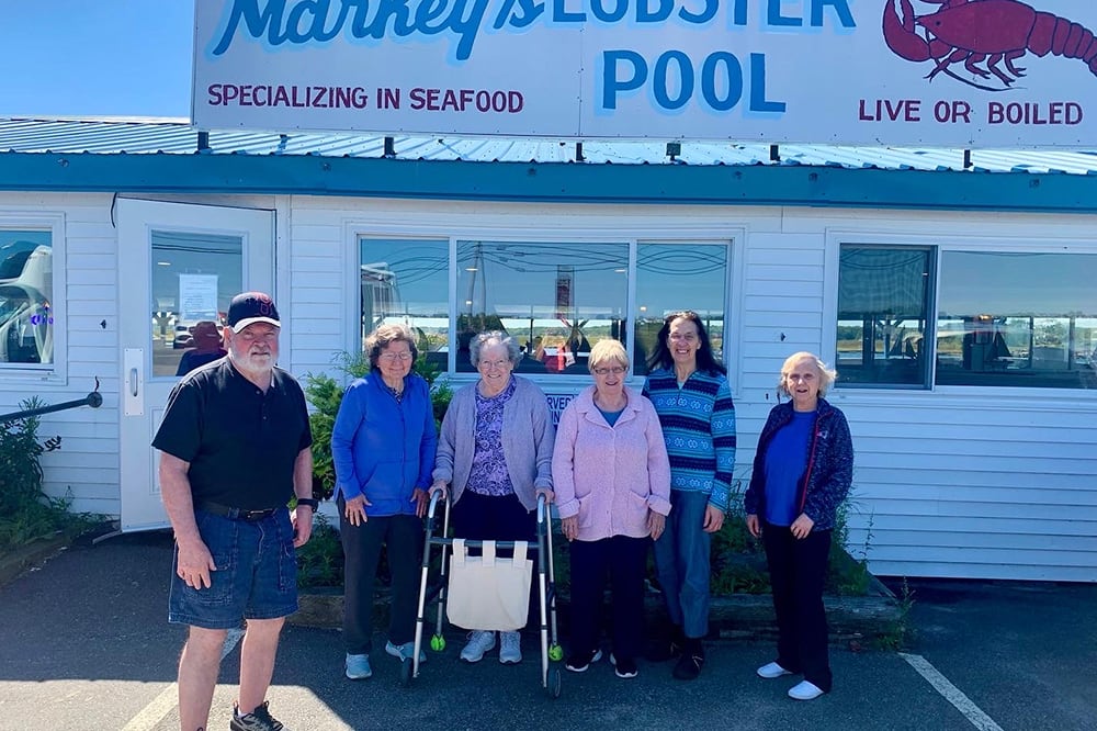 Group of residents outside a seafood restaurant