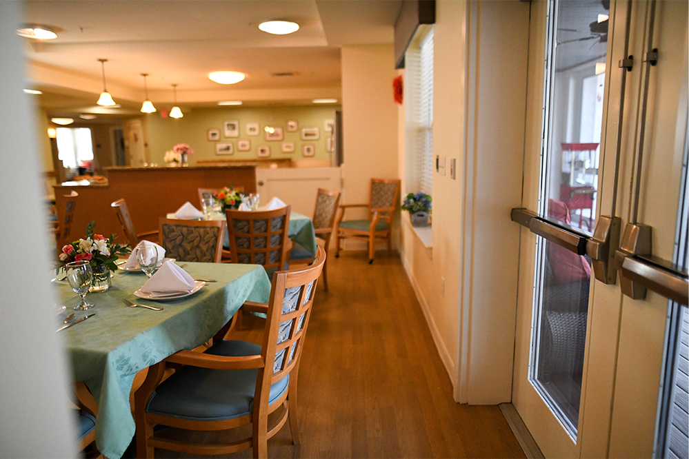 Dining room setup with tables and decorations