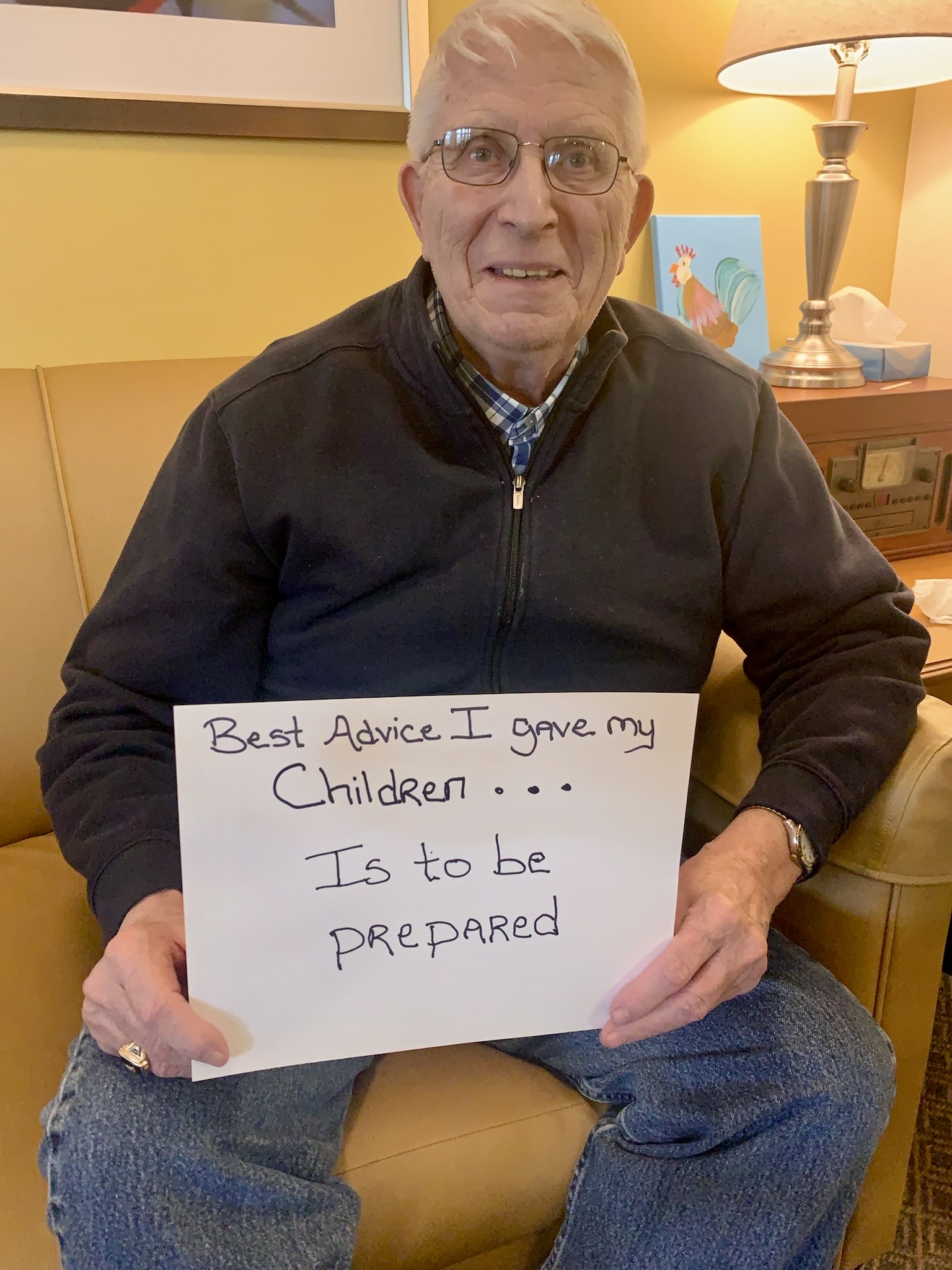 Resident holding a sign with advice