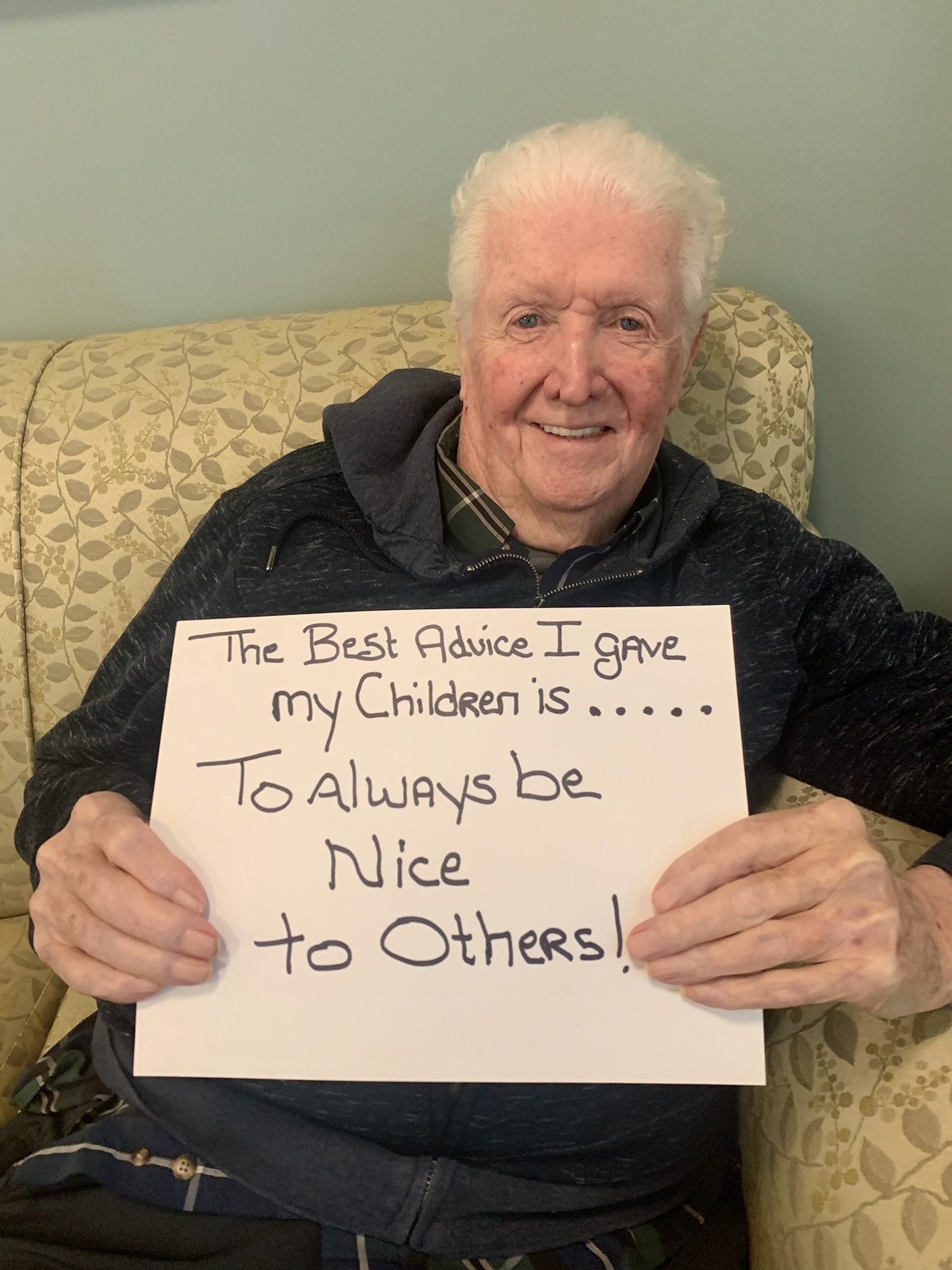 Resident holding a sign with advice