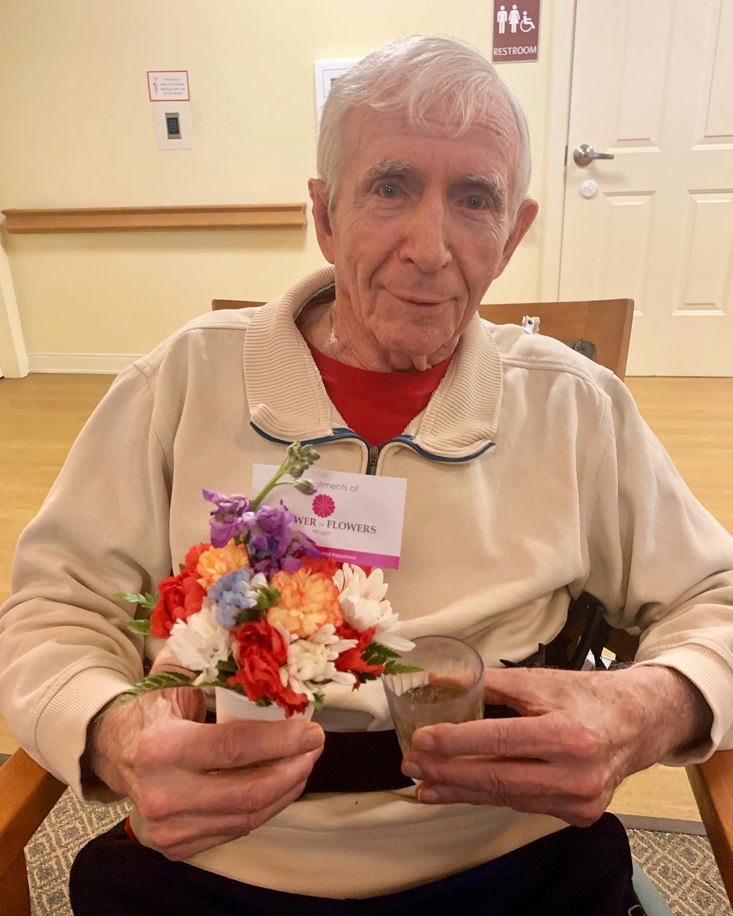 Resident holding a bouquet of flowers
