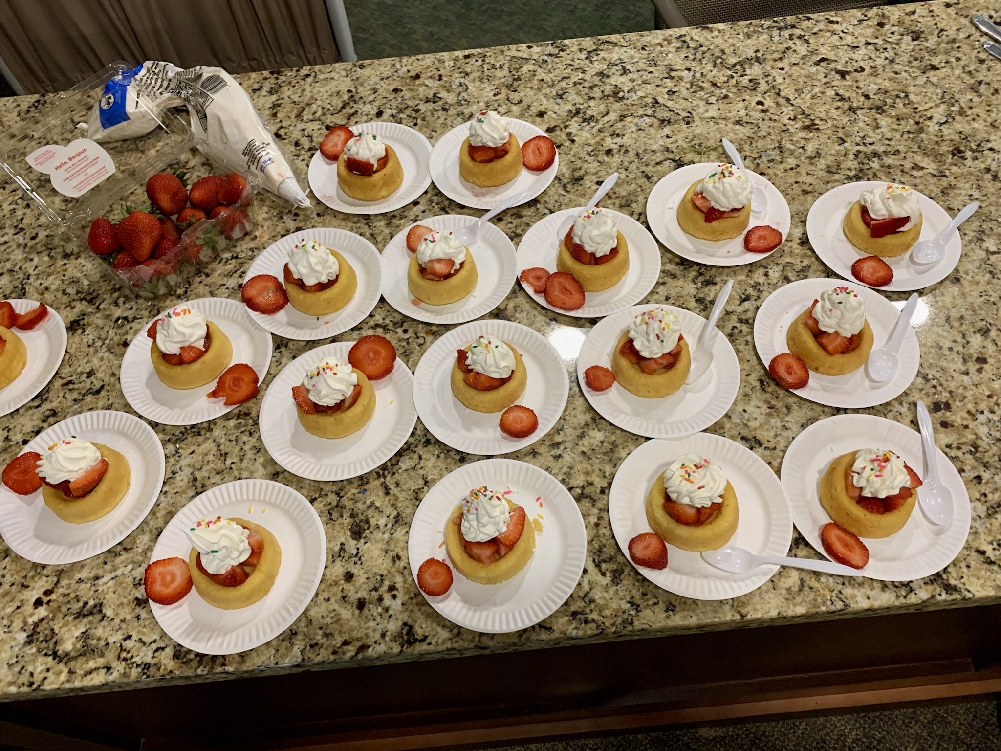 Dessert plates with cupcakes and strawberries for residents
