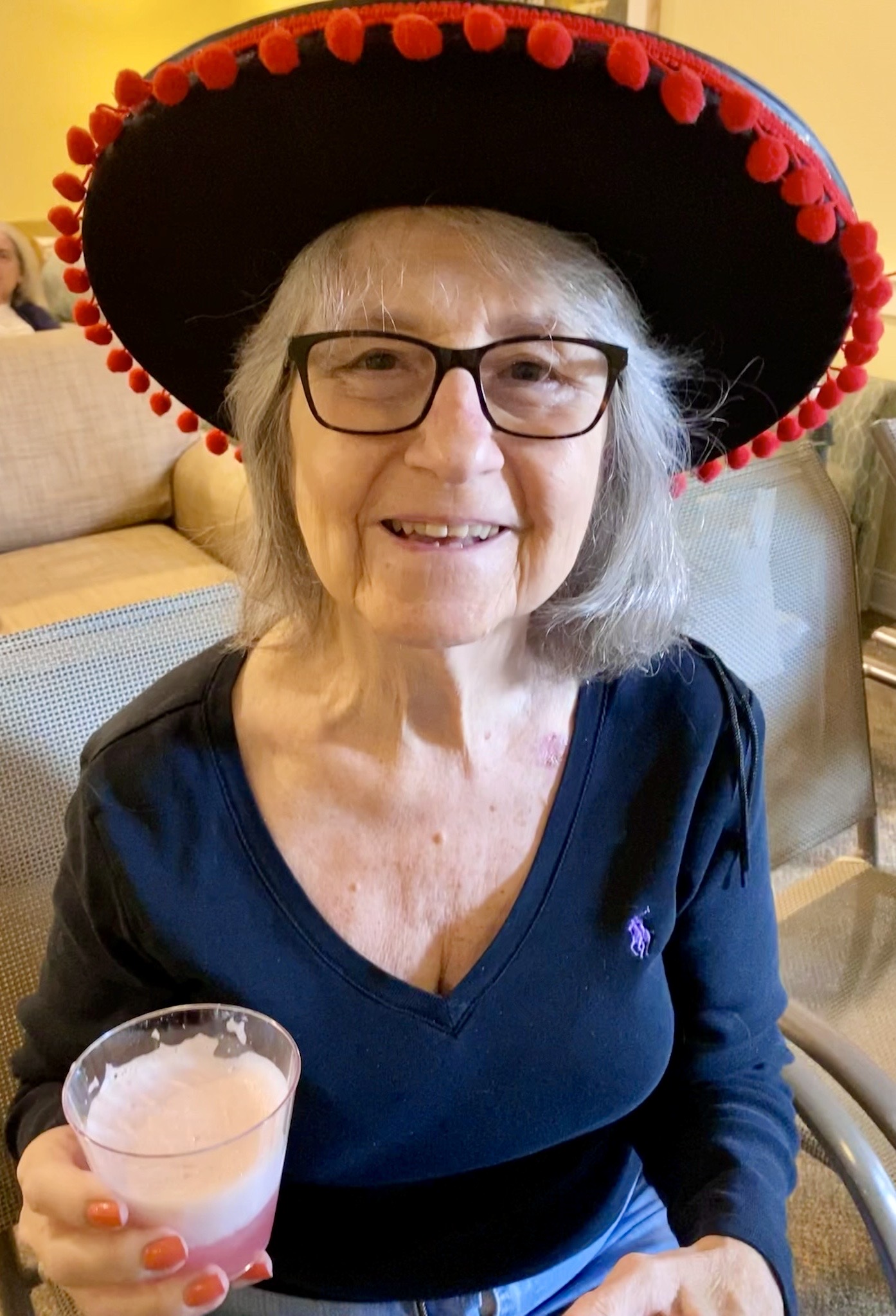 Resident enjoying a drink in a common area