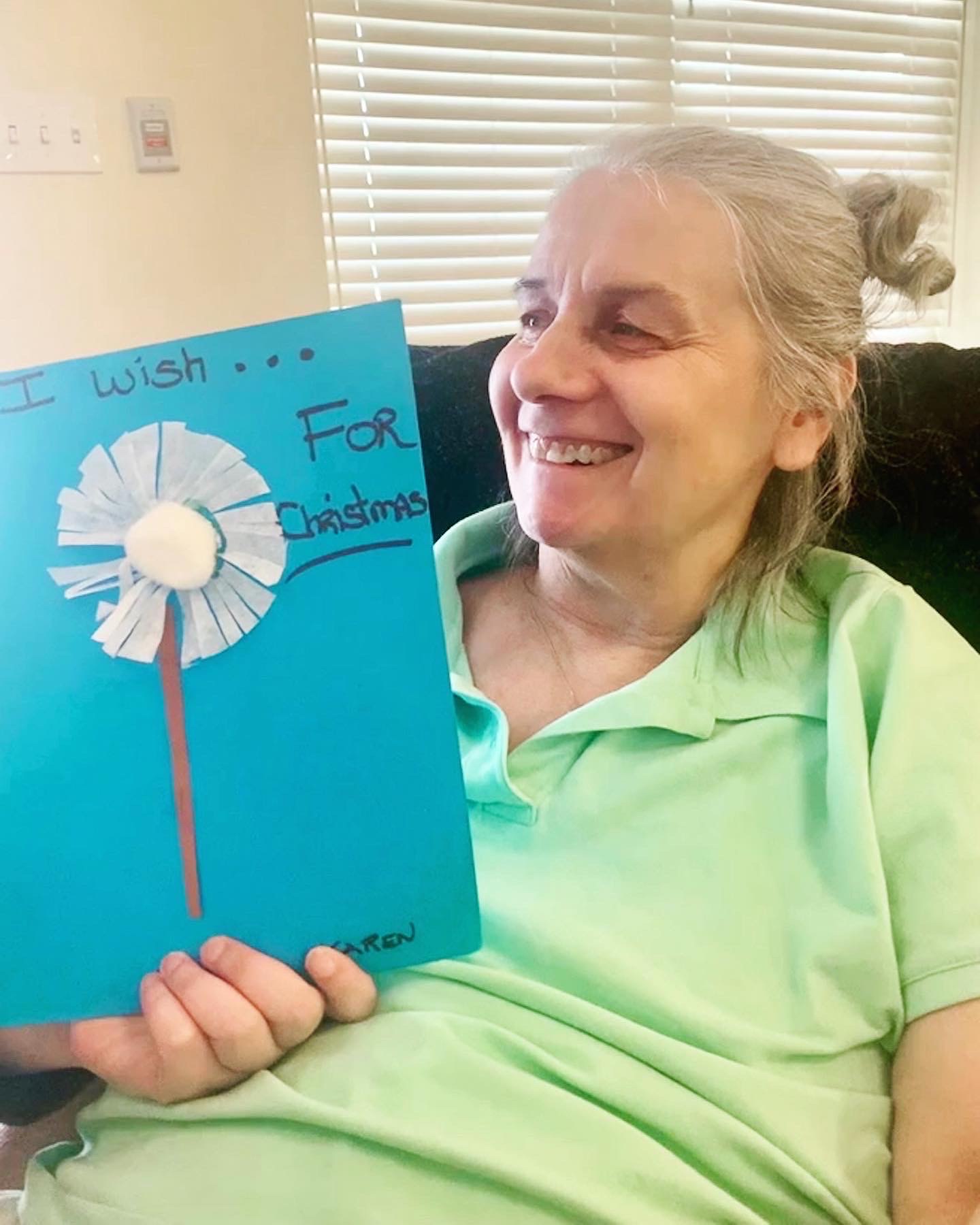 Resident engaging in an activity with a wish list