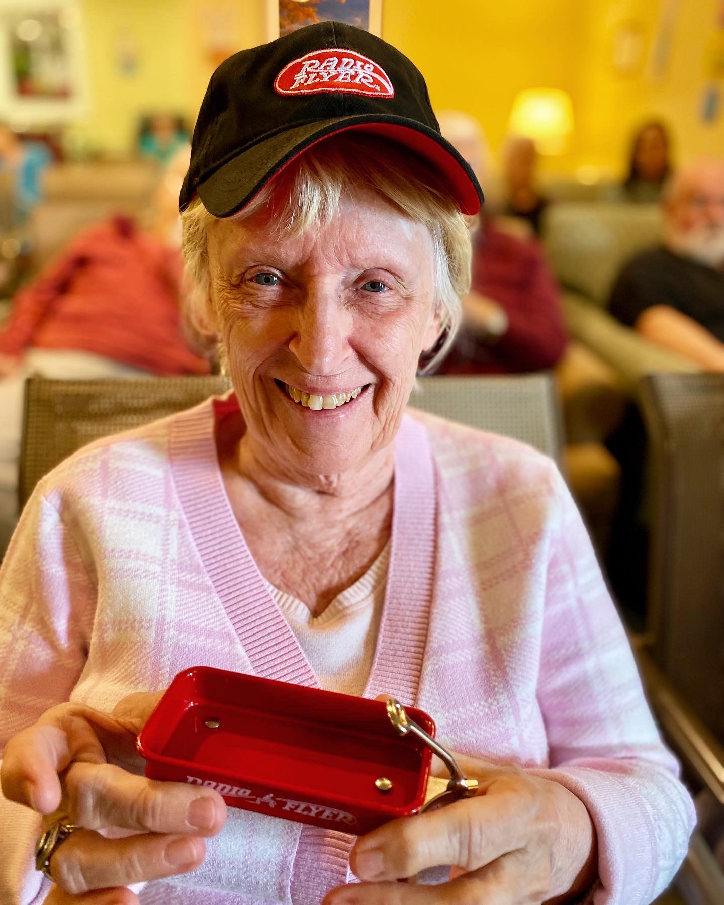 Resident smiling while participating in an activity