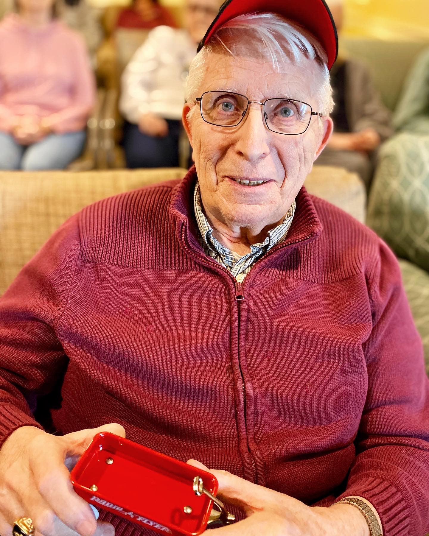 Resident engaging with a handheld device in a common area