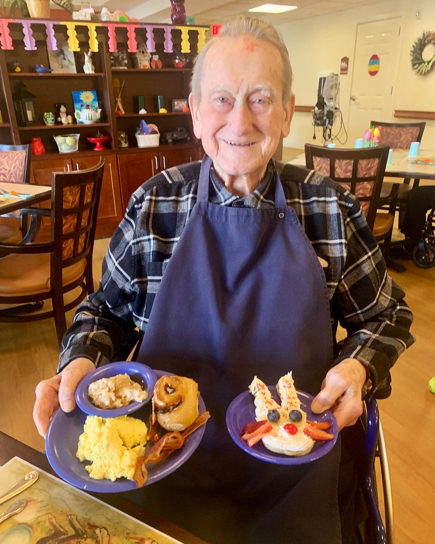 Resident enjoying a festive meal in a dining area