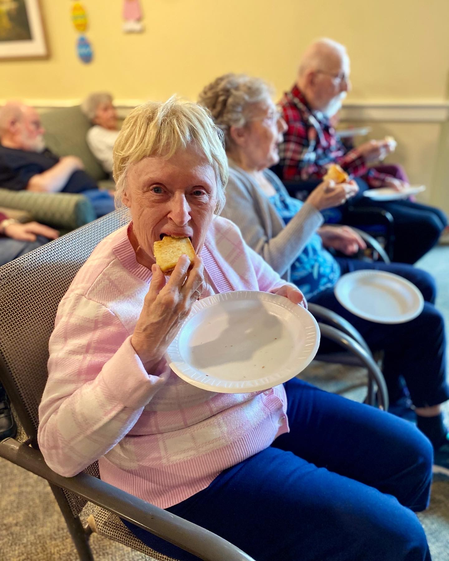Residents enjoying snacks in a common area