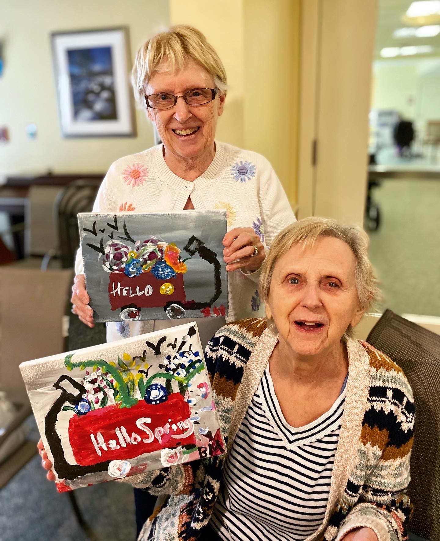Residents showing their spring-themed artwork