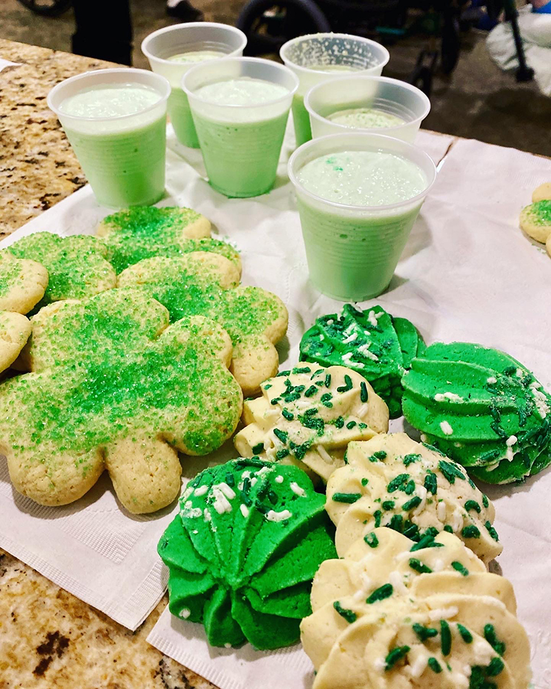 Green-themed cookies and drinks for a celebration