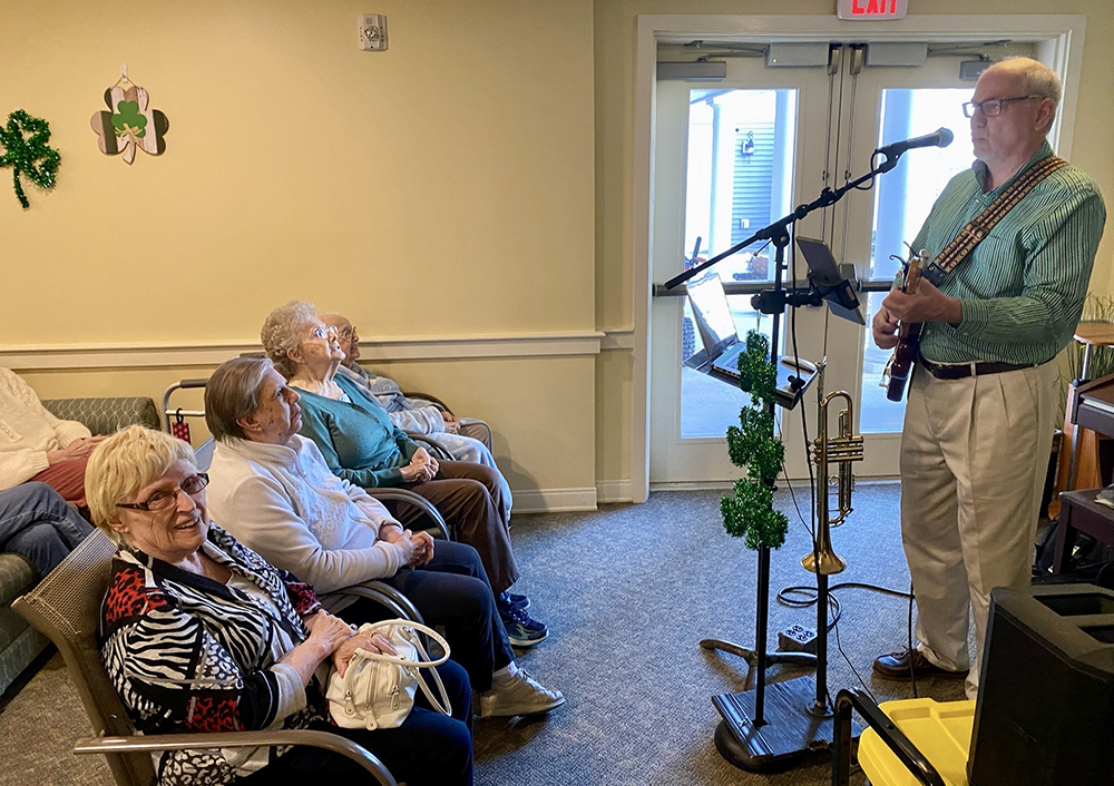 Residents enjoying live music in a common area