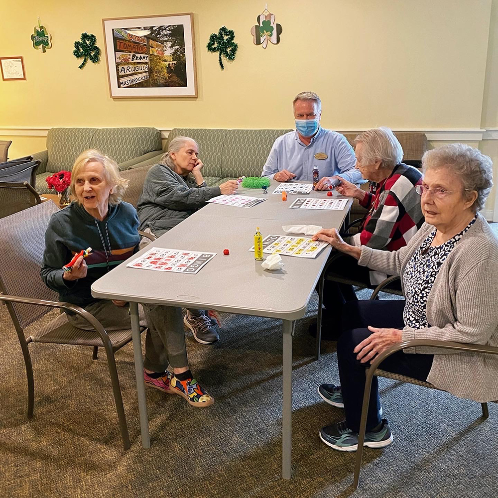 Residents participating in a bingo game at a activity room