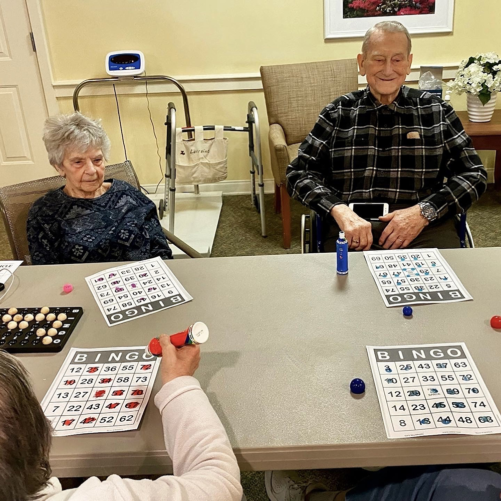 Residents playing bingo in a common area