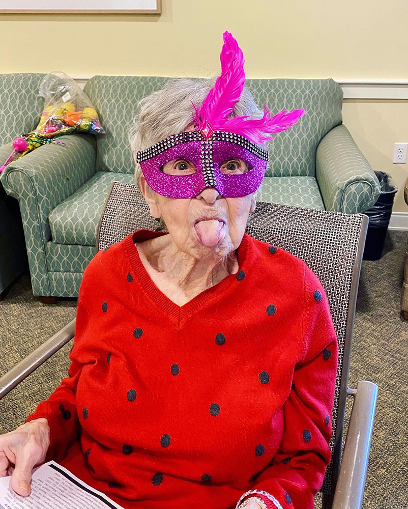 Resident wearing a colorful mask during an activity