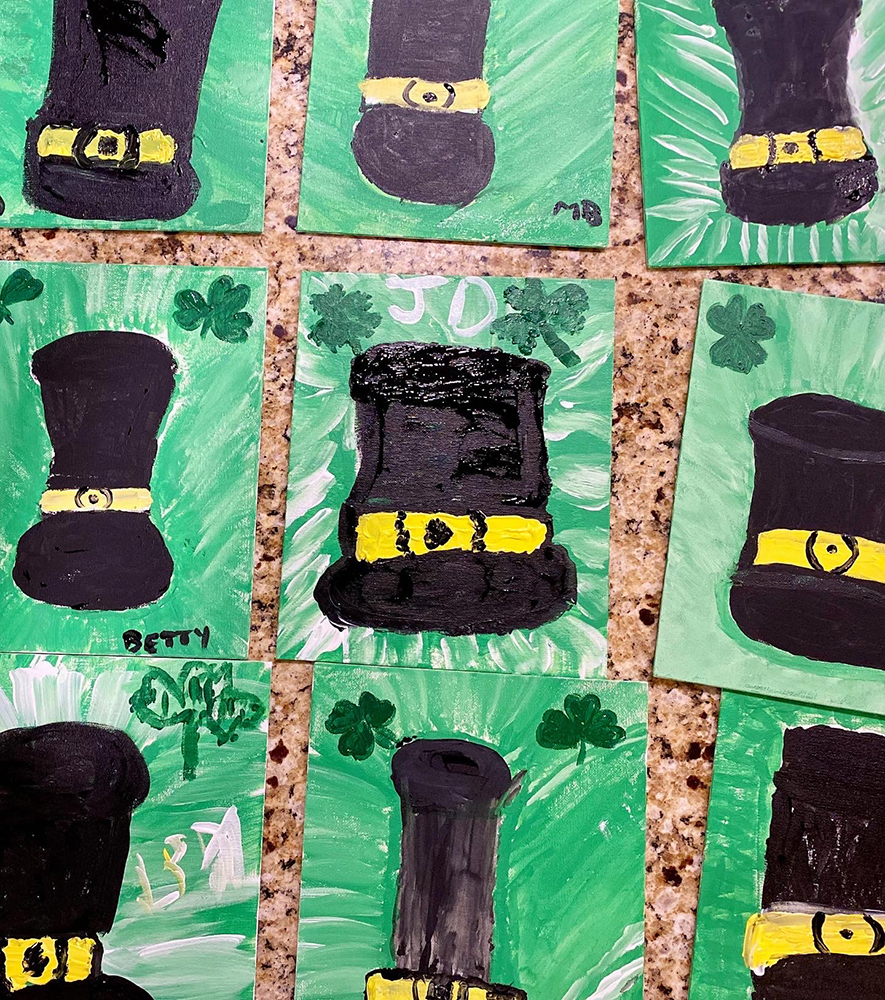 Paintings of black hats on green backgrounds