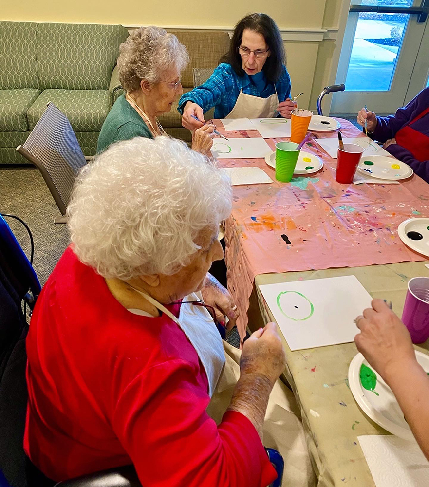 Residents enjoying an art activity in a common area