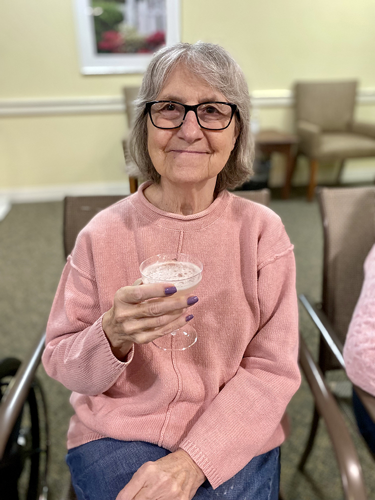A resident enjoying a drink in common area