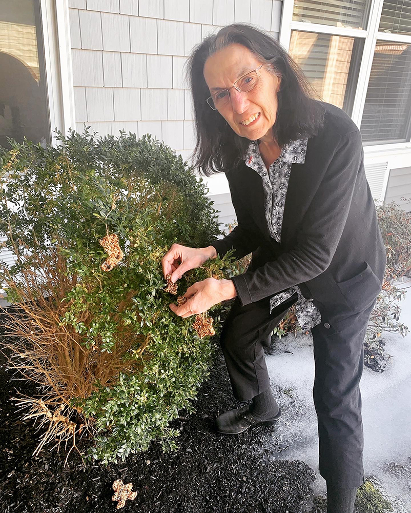 Resident gardening outside the facility
