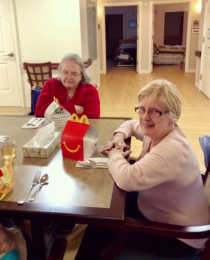 Residents enjoying a meal in the dining area