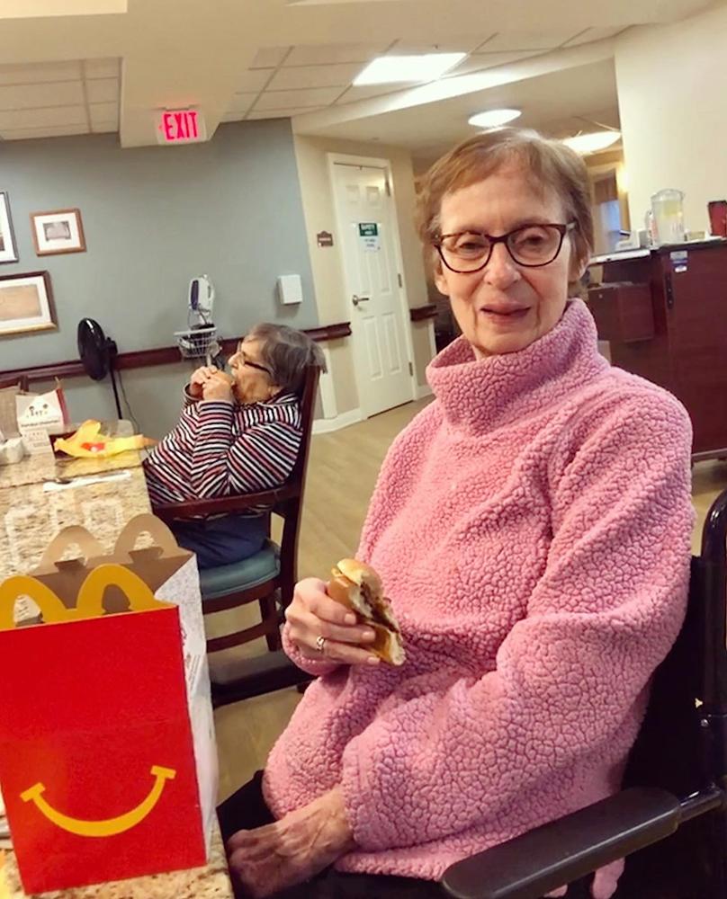 Two residents enjoying a meal in a common area