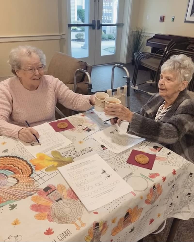 Residents enjoying a craft activity at a table