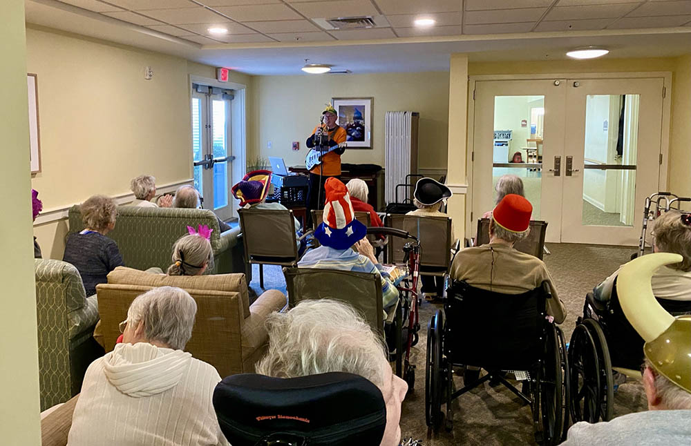 Residents enjoying a performance in a common area