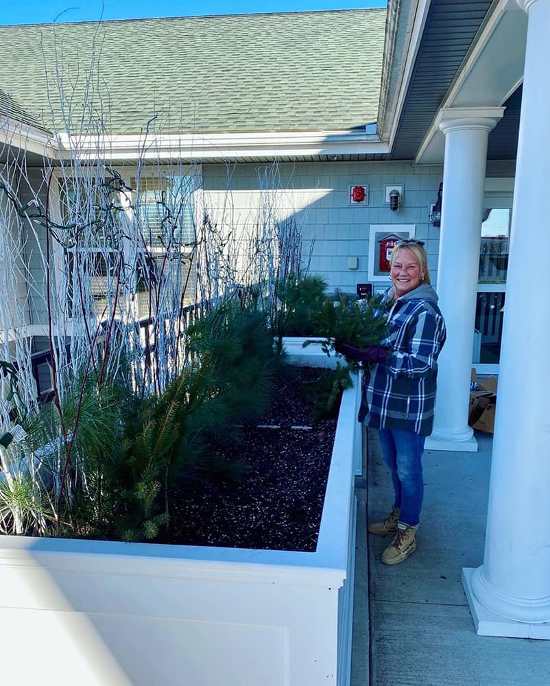 Resident gardening in an outdoor planter