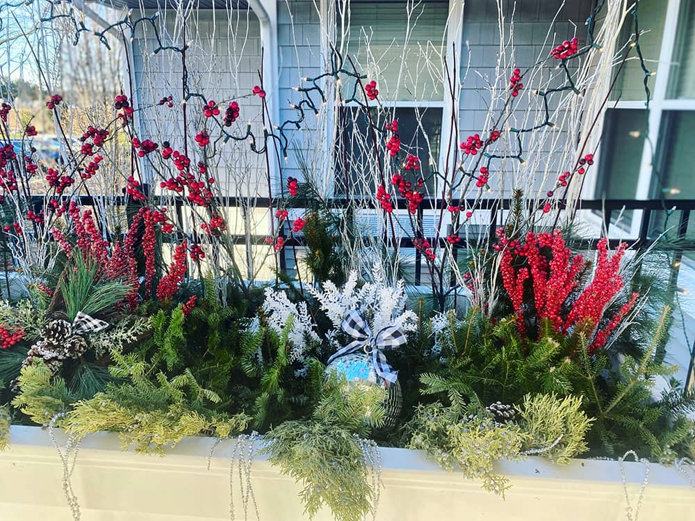 Decorative outdoor planter with festive foliage