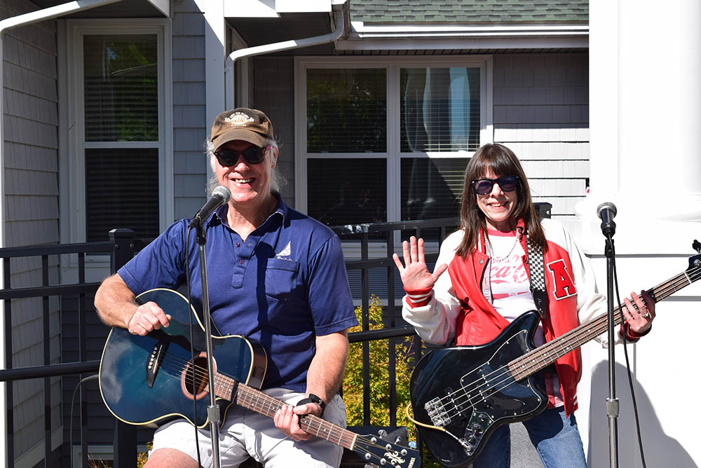 Musicians performing outdoors for residents