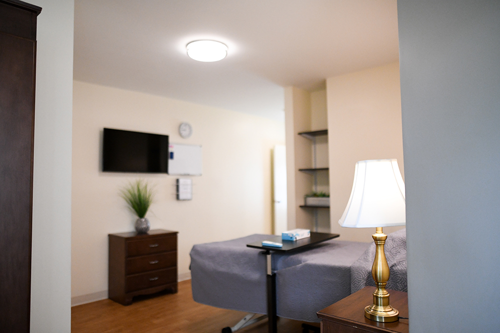 Cozy resident room with a bed and TV