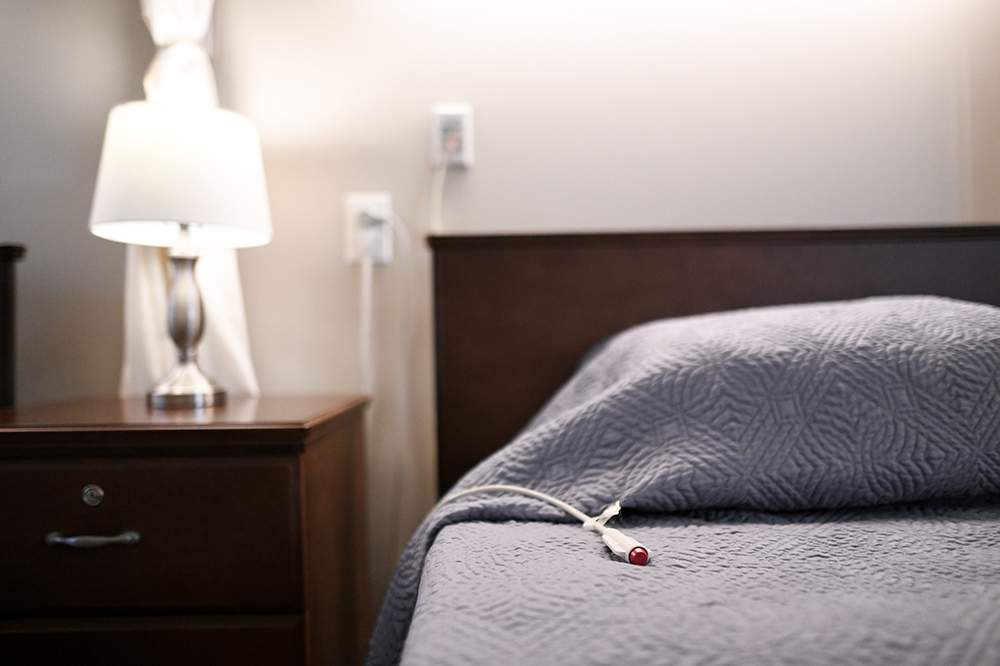 Close-up of a resident's room with a bedside table