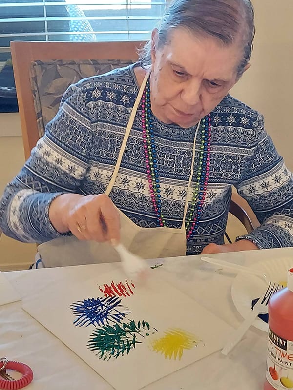 Resident engaged in a painting activity